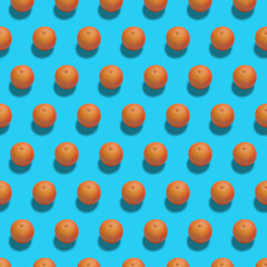 Fresh ripe fruits on color background. Pattern with orange grapefruit on blue background . Top view. Pop art design, creative summer food concept.