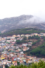 Fototapeta na wymiar Ausblick auf die Gemeinde Arbus in den Bergen auf SüdSardinien in Italien mit Wolken in den Hügeln