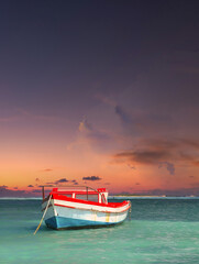 Fototapeta premium Fisherman's boat in a tranquil bay outside of Oranjestad Aruba of the Netherlands