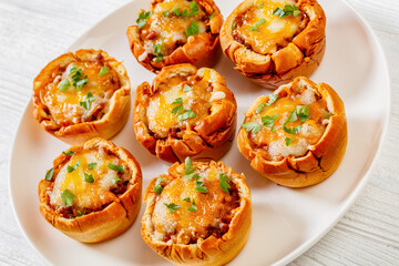 sloppy joe cups on white plate, top view
