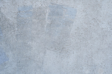 Uneven rough patterned gray cement wall, plaster wall background texture