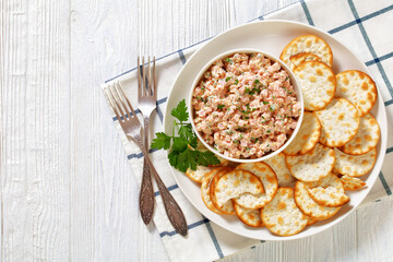 classic ham salad with crackers on white plate