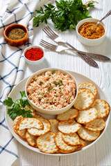 classic ham salad with crackers on white plate