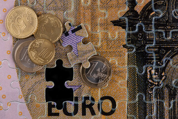 Conceptual plot about the euro currency using a puzzle of 100 euro bills