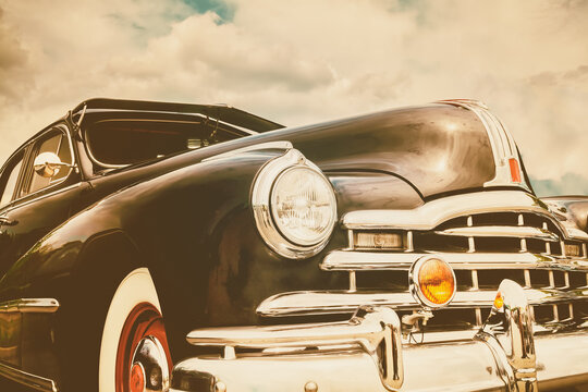 Retro styled front view of a black fifties American car