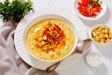 savory creamy pumpkin soup in bowl, top view