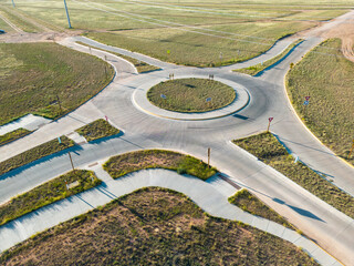 Rural roundabout from aerial drone for circle road in laramie wyoming to reduce traffic