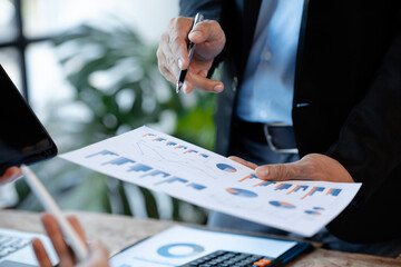 Atmosphere of a startup company meeting, business people are meeting together to summarize and plan investment finances, they are the founders of the company. Business administration concept.