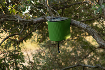 Plastic water dispenser on tree, outdoor recreation, camping, campers