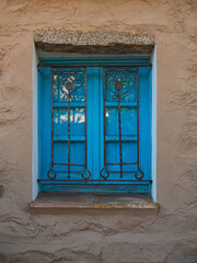 blue old Italian window with shutters