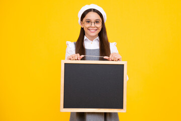 Little girl teen with blackboards. Teenager school girl hold blackboard for copy space, school sale. Happy face, positive and smiling emotions of teenager girl.