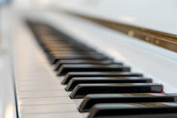 Close-up of piano keys with a blurred background