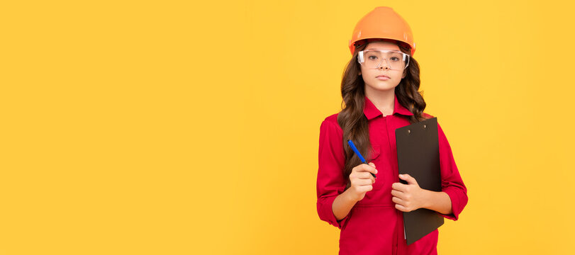 Engineer teenager girl. serious child girl in protective hard hat and glasses hold folder with paper documents, examining. Child builder in helmet horizontal poster design. Banner header, copy space.