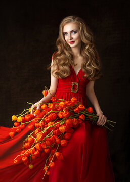 A series of studio photos of a young model with long blond hair in a red dress with a bouquet of dry orange fesalis flowers on a black background