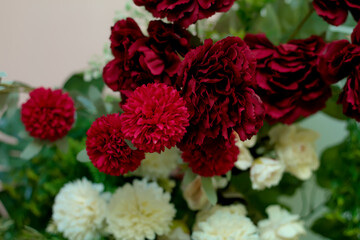 Artificial flowers or leaves made of plastic.