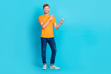 Full length photo of hooray red hair guy index promo wear t-shirt jeans sneakers isolated on teal...