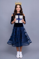 Child teen girl 12-14 years old with gift on isolated background. Birthday, holiday concept....