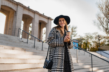 Fototapeta premium attractive young woman walking in autumn wearing coat