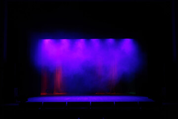 Theatrical scene without actors, scenic colorful light and smoke
