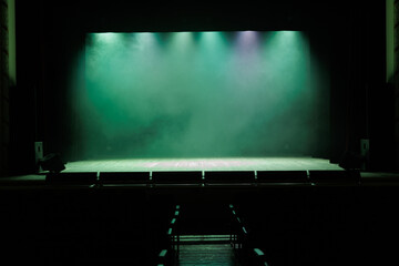 Theatrical scene without actors, scenic light and smoke