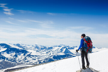 Fototapeta na wymiar Traveler with backpack and mountain panorama. Norway