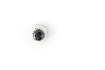 CCTV with the dome is hung on a white ceiling for circuit television guard protection..