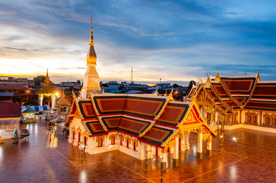 High angle view of Phra That Choeng Chum at Sakon Nakhon Province in sunset time that sky is orange  at 17 Sep 2021