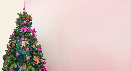 A banner with a Christmas tree with colorful decorations, highlighted on a white background with a copy of the space on the right