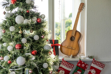 Flat lay composition with guitar and Santa hat, space for text. Christmas music