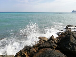 Some waves crashing against the rocks