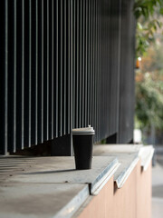 A COFFEE GLASS IS LONELY STANDING ON THE STREET