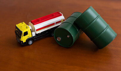small toy combine with toy oil barrel