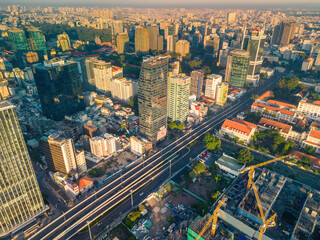 Aerial panoramic cityscape view of Ho Chi Minh city and Saigon river, Vietnam. Center of heart business at downtown with buildings and towers.
