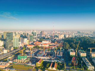 Obraz premium Aerial panoramic cityscape view of Ho Chi Minh city and Saigon river, Vietnam. Center of heart business at downtown with buildings and towers.
