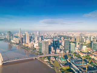 Aerial panoramic cityscape view of Ho Chi Minh city and Saigon river, Vietnam. Center of heart business at downtown with buildings and towers.
