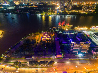 Aerial view of Ho Chi Minh City skyline and skyscrapers on Saigon river, Nha Rong wharf and Bach Dang harbor. Colorful Saigon river at sunset. Travel concept.