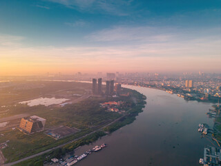 Aerial view of Ho Chi Minh City skyline and skyscrapers on Saigon river, center of heart business at downtown. Morning view. Far away is Landmark 81 skyscraper