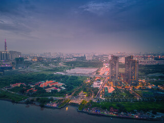 Aerial view of Ho Chi Minh City skyline and skyscrapers on Saigon river, center of heart business at downtown. Morning view. Far away is Landmark 81 skyscraper