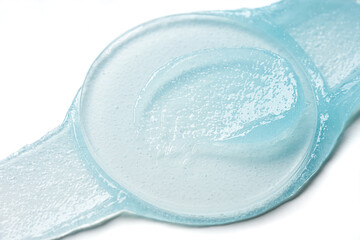 Brushes of light blue gel on a light background.