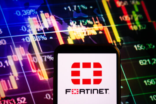 KONSKIE, POLAND - September 04, 2022: Smartphone displaying logo of Fortinet company on stock exchange chart background