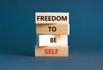 Freedom to be self symbol. Concept words Freedom to be self on wooden blocks on a beautiful grey table grey background. Business, psychological freedom to be self concept.
