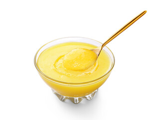 Ghee, Clarified butter bowl with spoon on white background