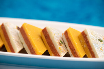 Indian Mithai Kaju Kesar Choco Gulkand Sandwich Burfi Also Known As Kajoo Barfi Is Diamond Shaped Sweet Made Of Cashew Nuts, Chocolate, Saffron, Mawa, Mava, Malai, Khoya, Doodh, Badam, Khoa, Pista