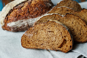 Freshly baked bread with a golden crust close up. Yeast dough. Concept of bakery products, bakery and healthy eating
