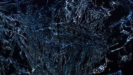 Distressed background. Crumpled noise texture. Creased plastic film. Blue white glowing wrinkles on crinkled grunge dark black abstract illustration modern overlay.