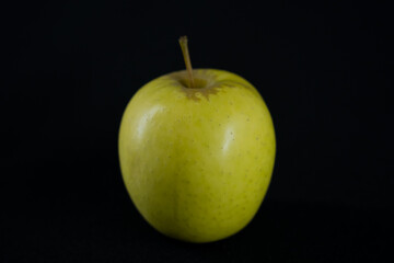 an apple on a dark background