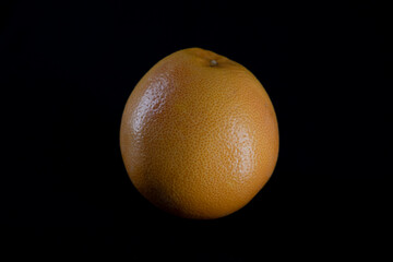 grapefruit on a dark background