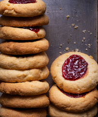 Argentinian traditional cookies called Pepas filled with jam placed on old iron tray