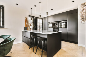 Kitchen zone with counter in modern studio apartment