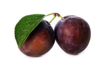 wet purple plums with leaf isolated on white background